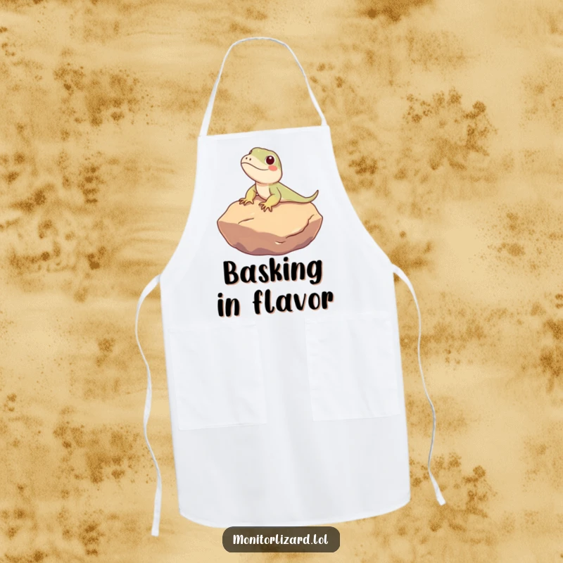 Funny Monitor Lizard Apron: A cute monitor lizard character humorously sunbathes on a warm rock, perfect for relaxed cooking.