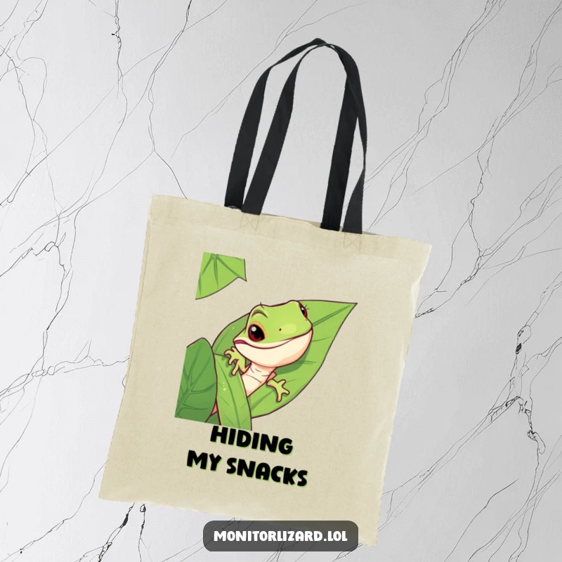 Funny monitor lizard tote bag showing a mischievous lizard peeking from behind a large jungle leaf, practical and stylish.